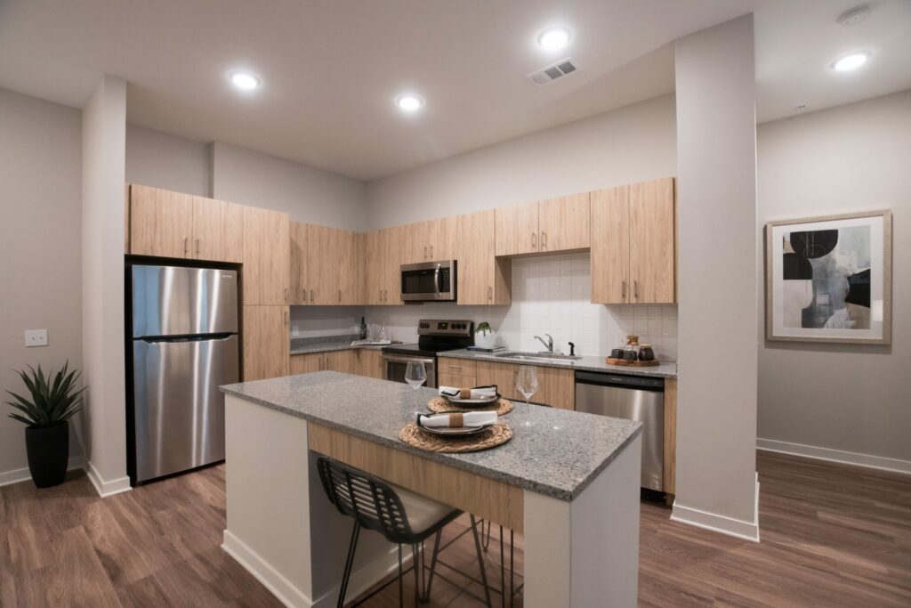 Feels Like a Luxury Experience - kitchen interior with chef's island, granite countertops, and stainless steel appliances